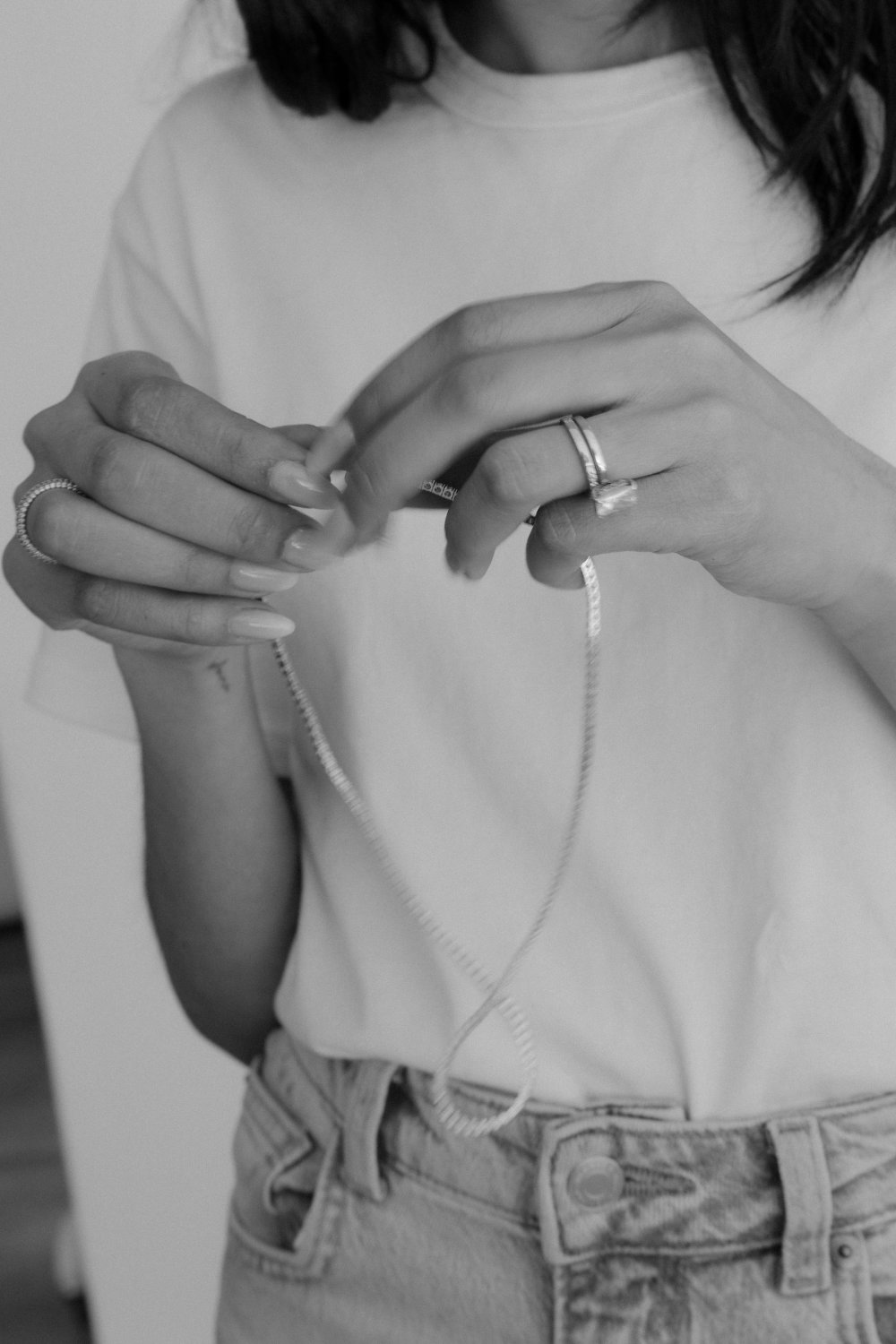 Hands holding a diamond ring